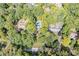 Aerial view of neighborhood with houses and lush green trees at 8954 Briarclift Rd, Indianapolis, IN 46256