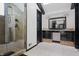 Elegant bathroom with double vanity, large shower, and skylight at 8954 Briarclift Rd, Indianapolis, IN 46256