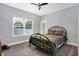 Bedroom with a metal bed frame and large window at 6129 Crittenden Ave, Indianapolis, IN 46220