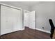 Spacious bedroom with hardwood floors and double door closets at 6129 Crittenden Ave, Indianapolis, IN 46220