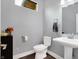 Clean and modern bathroom with pedestal sink and updated fixtures at 6129 Crittenden Ave, Indianapolis, IN 46220