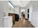 Bright laundry room with washer, dryer, sink, and access to kitchen at 6129 Crittenden Ave, Indianapolis, IN 46220
