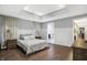 Spacious bedroom with wood floors, large windows and en-suite bathroom at 6129 Crittenden Ave, Indianapolis, IN 46220