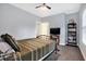 Bedroom with a metal bed frame and TV at 6129 Crittenden Ave, Indianapolis, IN 46220