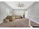 Spacious loft area with a large sectional sofa and ceiling fan at 6129 Crittenden Ave, Indianapolis, IN 46220