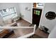 Bright entryway with a modern staircase, and a comfortable sitting area at 6129 Crittenden Ave, Indianapolis, IN 46220