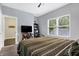 Cozy bedroom with a double bed and built-in shelves at 6129 Crittenden Ave, Indianapolis, IN 46220