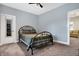 Bedroom with a metal bed frame and access to another room at 6129 Crittenden Ave, Indianapolis, IN 46220
