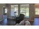 Relaxing living room with hardwood floors, large windows, and access to backyard at 1230 Thorndon Ct, Danville, IN 46122