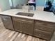 Kitchen island with double sink, granite countertop, and gray cabinets at 1230 Thorndon Ct, Danville, IN 46122