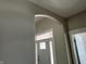 Bright entryway with an arched doorway and white front door at 1230 Thorndon Ct, Danville, IN 46122
