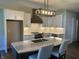 Modern kitchen with white cabinets and a stylish range hood at 1230 Thorndon Ct, Danville, IN 46122