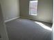 Empty bedroom with carpeted floor and a window allowing in sunlight at 1230 Thorndon Ct, Danville, IN 46122