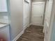 Bright hallway with hardwood floors and neutral-colored walls at 1230 Thorndon Ct, Danville, IN 46122