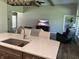 Modern kitchen island with a granite countertop and stainless steel sink at 1230 Thorndon Ct, Danville, IN 46122
