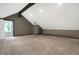 Spacious bonus room with neutral carpeting and a projector at 6129 Crittenden Ave, Indianapolis, IN 46220