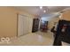 Open dining area with adjacent living space and built-in shelving at 5347 Waterton Lakes Dr, Indianapolis, IN 46237