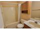 Clean bathroom with tub, shower, and wood cabinet at 5347 Waterton Lakes Dr, Indianapolis, IN 46237