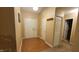 Bright entryway with wood-look floors, double doors, and coat rack at 5347 Waterton Lakes Dr, Indianapolis, IN 46237
