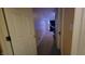 Long hallway with carpeted floors and doors to other rooms at 5347 Waterton Lakes Dr, Indianapolis, IN 46237