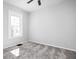 Bright bedroom with gray walls, carpet, and a ceiling fan at 1526 Lawton Ave, Indianapolis, IN 46203