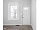 Bright entryway with new flooring and a classic white door at 1526 Lawton Ave, Indianapolis, IN 46203
