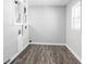 Bright laundry room with vinyl flooring and a window at 1526 Lawton Ave, Indianapolis, IN 46203