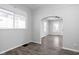 Bright dining area with wood flooring and view of the living room at 1526 Lawton Ave, Indianapolis, IN 46203