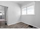 Simple dining area with wood flooring and built-in shelving at 1526 Lawton Ave, Indianapolis, IN 46203