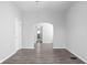 Spacious living room with hardwood floors and an arched doorway at 1526 Lawton Ave, Indianapolis, IN 46203