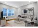 Living room with hardwood floors, comfortable seating, and large window at 515 Orange St, Indianapolis, IN 46203