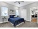 Spacious bedroom with plush carpeting and access to the kitchen at 515 Orange St, Indianapolis, IN 46203
