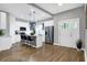 Modern kitchen with white cabinets, a kitchen island and hardwood floors at 515 Orange St, Indianapolis, IN 46203