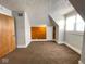 Bright bedroom with wood accent wall and carpet at 712 W Queen St, Muncie, IN 47303