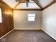 Simple bedroom with wood paneling and ceiling fan at 712 W Queen St, Muncie, IN 47303