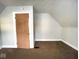 Simple bedroom with brown carpet and a closet at 712 W Queen St, Muncie, IN 47303