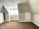 Spacious bedroom with brown carpet and built in closet at 712 W Queen St, Muncie, IN 47303