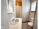 Clean bathroom with single sink vanity, toilet and a mirror at 712 W Queen St, Muncie, IN 47303