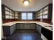 U-shaped kitchen with gray cabinets and ample storage at 712 W Queen St, Muncie, IN 47303