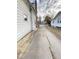Long driveway with some cracking and weeds at 712 W Queen St, Muncie, IN 47303