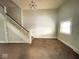 Living room with staircase and carpeted floors at 712 W Queen St, Muncie, IN 47303