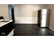 Kitchen area with stainless steel refrigerator at 712 W Queen St, Muncie, IN 47303