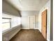 Bright bedroom with two windows and brown carpet at 712 W Queen St, Muncie, IN 47303