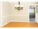 Formal dining room with hardwood floors and chandelier at 6205 Bramshaw Rd, Indianapolis, IN 46220