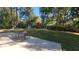 Spacious backyard with a shed, playset, and patio at 6205 Bramshaw Rd, Indianapolis, IN 46220