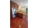Modern kitchen with hardwood floors and stainless steel appliances at 6205 Bramshaw Rd, Indianapolis, IN 46220