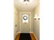 Bright entryway with hardwood floors and wreath at 6205 Bramshaw Rd, Indianapolis, IN 46220