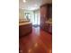 Kitchen with hardwood floors, island, and access to backyard at 6205 Bramshaw Rd, Indianapolis, IN 46220
