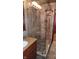 Spa-like shower with pebble tile floor and glass enclosure at 6205 Bramshaw Rd, Indianapolis, IN 46220