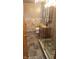 Updated bathroom with a large walk-in shower and pebble tile floor at 6205 Bramshaw Rd, Indianapolis, IN 46220